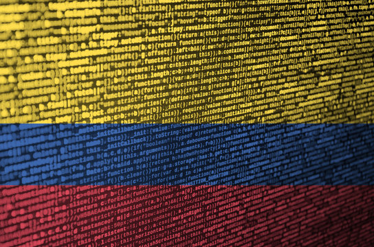 Colombia flag  is depicted on the screen with the program code. The concept of modern technology and site development