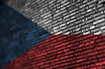 Czech flag  is depicted on the screen with the program code. The concept of modern technology and...