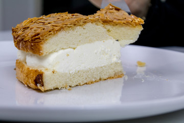 eating a caramel almond ice cream cake