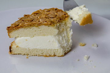 eating a caramel almond ice cream cake