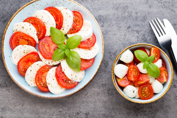 Classic caprese salad. Mozzarella tomatoes and  Basilikum.