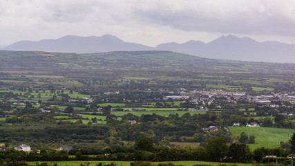 Fototapeta na wymiar view of an Irish Valley with mountains behind in county Kerry, Ireland