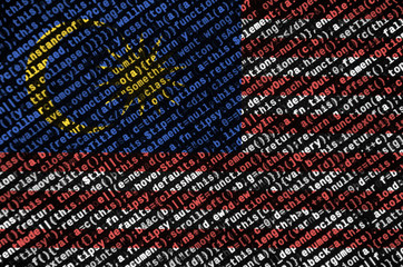 Malaysia flag  is depicted on the screen with the program code. The concept of modern technology...