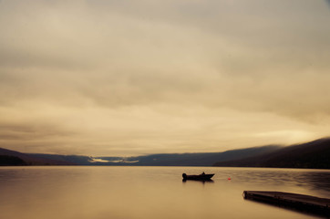 boat on lake at sunset