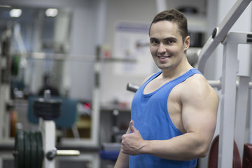 Fototapeta na wymiar young man working out in gym