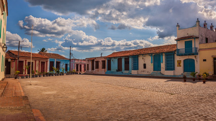 Fototapeta na wymiar San Juan de Dios square with colorful colonial houses, Camaguey, Cuba