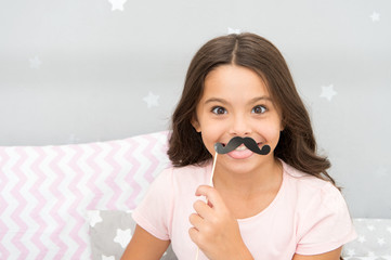 Slumber party photo booth props. Kid girl cheerful posing with black mustache party attribute. Prepare photo booth props hand made or buy for party. Printable photo booth props pajama party © be free
