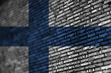 Finland flag  is depicted on the screen with the program code. The concept of modern technology and...