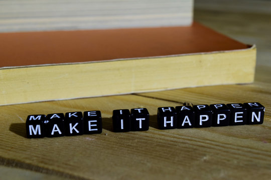 Make it happen on wooden blocks. Motivation and inspiration concept. Cross processed image