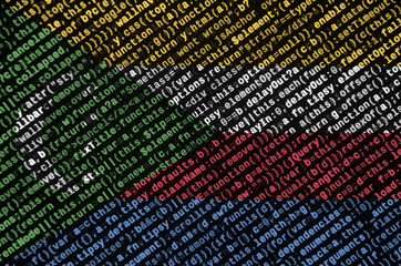 Comoros flag  is depicted on the screen with the program code. The concept of modern technology and site development