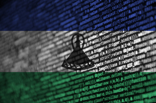 Lesotho flag  is depicted on the screen with the program code. The concept of modern technology and site development