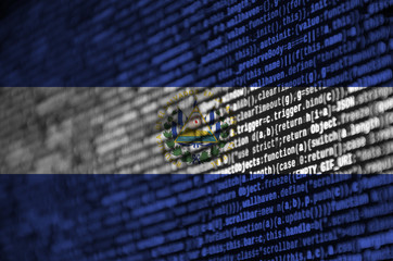 El Salvador flag  is depicted on the screen with the program code. The concept of modern technology...