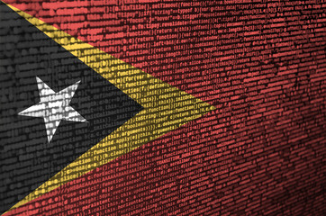 Timor Leste flag  is depicted on the screen with the program code. The concept of modern technology...