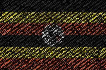 Uganda flag  is depicted on the screen with the program code. The concept of modern technology and...