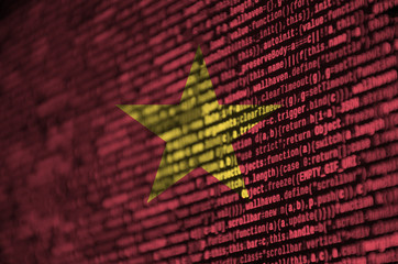 Vietnam flag  is depicted on the screen with the program code. The concept of modern technology and...