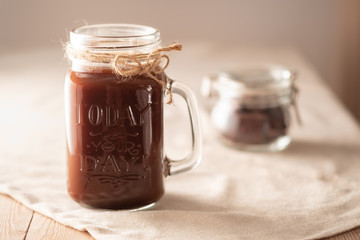 hot chocolate in a tall glass jar.