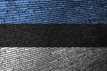 Estonia flag  is depicted on the screen with the program code. The concept of modern technology and...