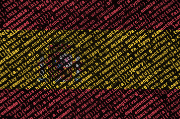 Spain flag  is depicted on the screen with the program code. The concept of modern technology and...