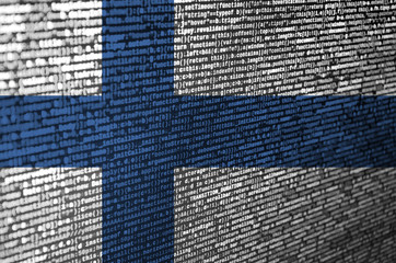 Finland flag  is depicted on the screen with the program code. The concept of modern technology and...