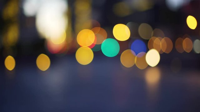 City bokeh lights with glowing traffic lights for green screen or chroma key. Out of focus or defocused shot for compositing or keying. 