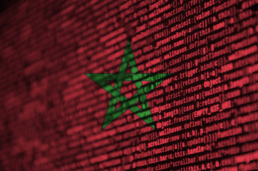 Morocco flag  is depicted on the screen with the program code. The concept of modern technology and...