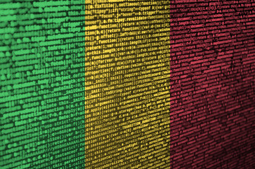 Mali flag  is depicted on the screen with the program code. The concept of modern technology and...