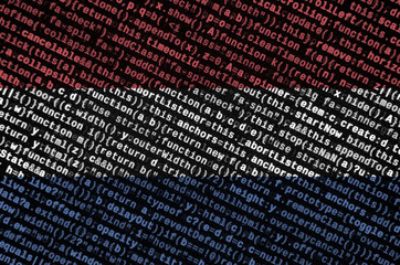 Netherlands flag  is depicted on the screen with the program code. The concept of modern technology...