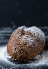 Fototapeta na wymiar Flour rolls on whole grain bread with seeds