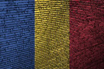 Romania flag  is depicted on the screen with the program code. The concept of modern technology and...