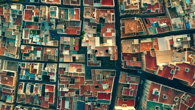 Aerial top down view to mosaic pattern of residential area roofs. Almeria, Spain