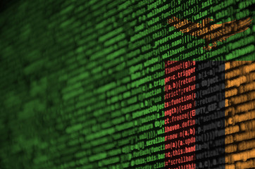 Zambia flag  is depicted on the screen with the program code. The concept of modern technology and...