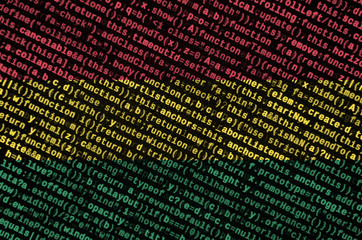Bolivia flag  is depicted on the screen with the program code. The concept of modern technology and...