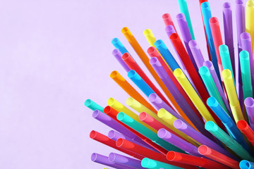straw straws plastic drinking disposable background colourful  full screen many group plastic single use ban banned straw  in EU concept - stock photo, stock photograph image picture  - obrazy, fototapety, plakaty