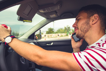 Guy having conversation on his phone while driving