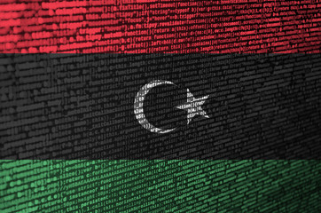 Libya flag  is depicted on the screen with the program code. The concept of modern technology and...