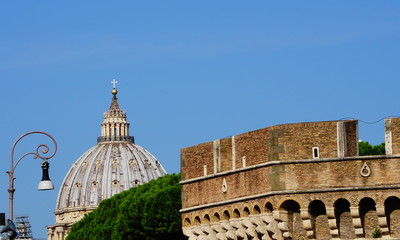 View of the dome of St. Peter's from the fortress of Castel Sant'Angelo in a sunny day