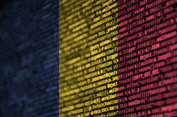 Chad flag  is depicted on the screen with the program code. The concept of modern technology and...