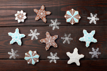 Many Gingerbread stars over wooden background.Sweet Background