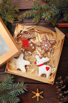 Christmas homemade gingerbread cookies deer with star in box. on wooden table with decoration.Closeup.top view