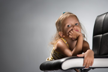 Girl four years on a chair