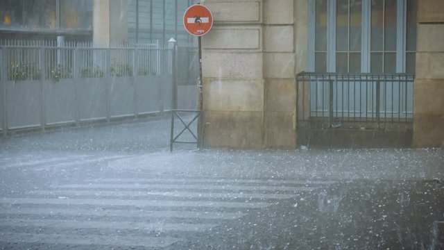 Extreme weather hail rain storm on the streets of Paris