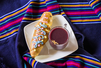traditional dish and drink Ecuador, called: Colada Morada and bread guaguas