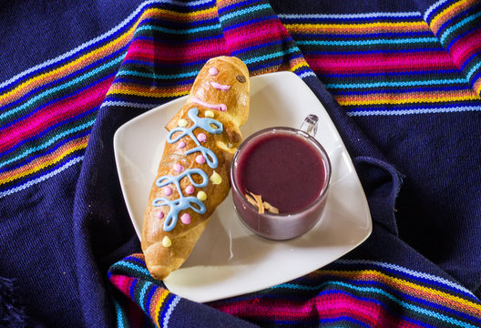 traditional dish and drink Ecuador, called: Colada Morada and bread guaguas
