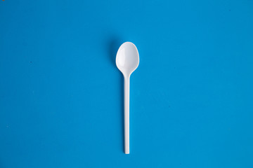 plastic spoon on colorful background