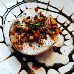 Peach Dessert with cream, walnuts, and chocolate sauce