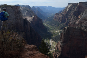 Hiker at a Peak in Zion National Park