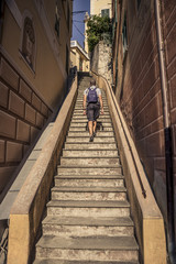 Obraz na płótnie Canvas Man climbing the stairs