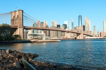 View of Brooklyn Bridge and Manhattan skyline at the early morning sun light - New York City...