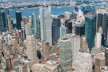 Aerial view of New York City - USA. Manhattan downtown skyline and skyscrapers from the Empire State Building in the morning.