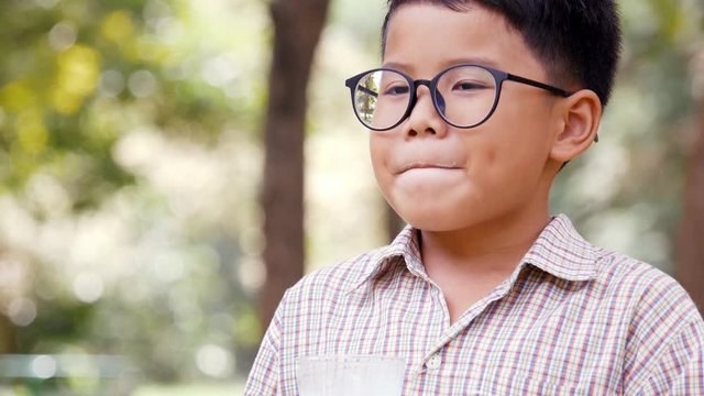 Boy drinking milk with nature background.